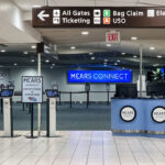 Mears Connect Driven by Sunshine airport shuttle bus at Orlando International Airport, providing Walt Disney World transportation in 2024