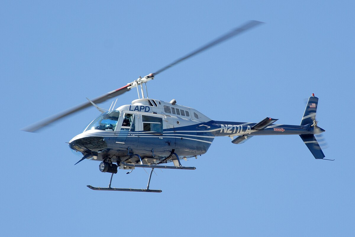 Police Helicopter in Urban Sky