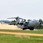 C-17 Globemaster III in flight, showcasing its large cargo capacity and strategic airlift capabilities