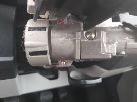 Red paint covering grub screws on VW Transporter ignition switch, needing removal for key cylinder access