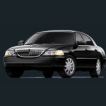 Elegant black town car providing private Kitsap airport transportation services