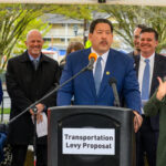 Mayor Harrell at podium discussing transportation levy proposal with city officials
