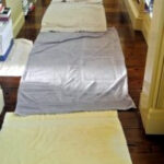 Before moving the piano, we lined the entire hallway with towels to protect the hardwood floors.