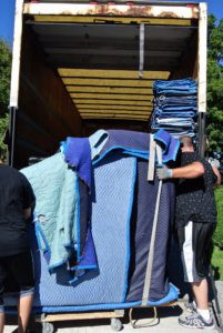 Luckily, Brian and Sean use a lift-gate truck, so the piano can just be loaded onto the lift and raised to the truck bed.