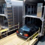 Enclosed auto transport by rail