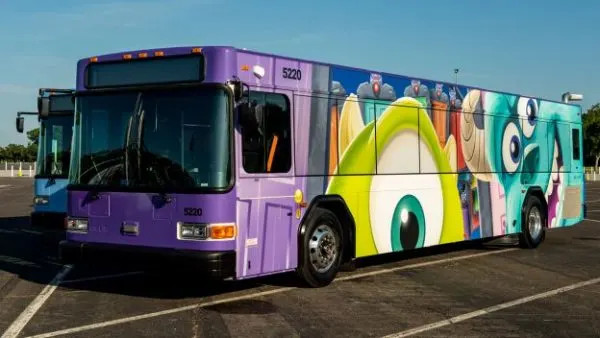 Exterior view of a Disney World bus at a bus stop