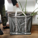 Sturdy tote bag ideal for transporting multiple potted plants, ensuring they remain upright and secure during relocation.
