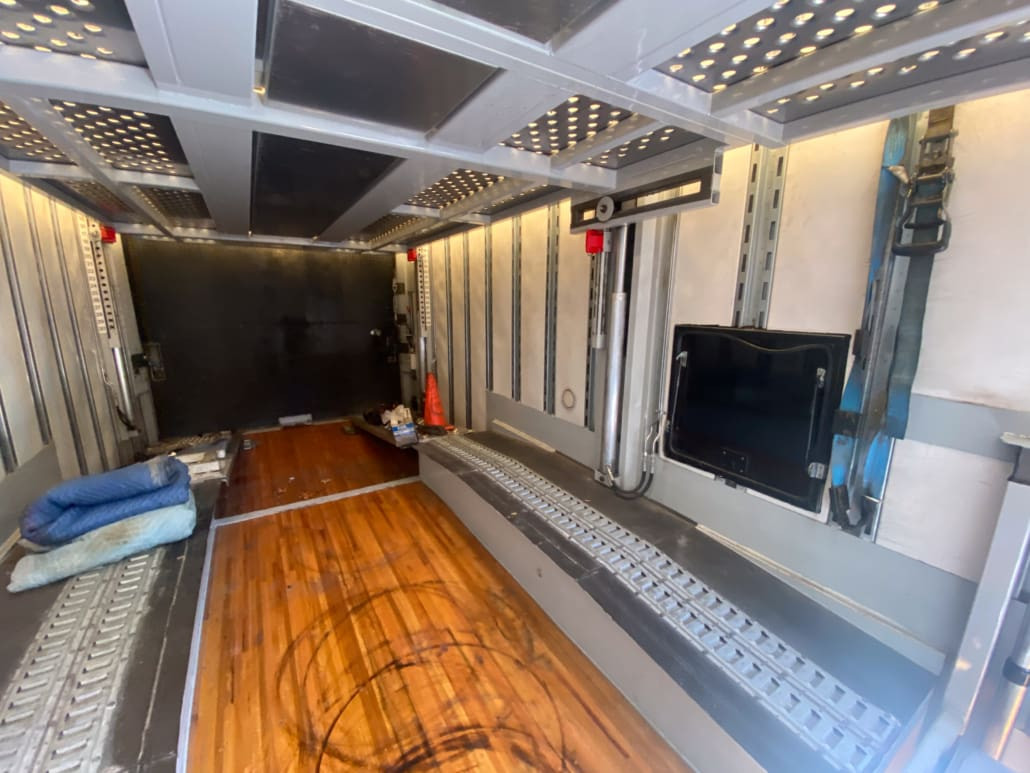 Aerodynamic front bubble design of the enclosed trailer, emphasizing fuel efficiency and enhanced storage space for enclosed auto transport trailers for sale.