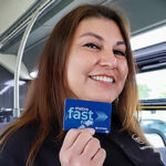 Madison Metro bus driver Lori demonstrating the Fast Fare card, a convenient payment method for Madison WI public transportation