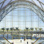 Exterior view of Anaheim Regional Transportation Intermodal Center showcasing its parabolic diagrid structure and surrounding landscape, Anaheim, California