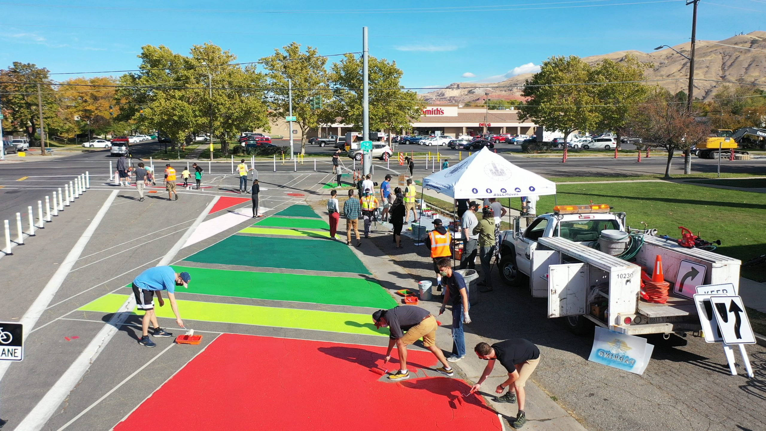 Community members collaborate on a street mural in Salt Lake City's Rose Park neighborhood, part of the Westside Transportation Equity Study to improve equity transportation.