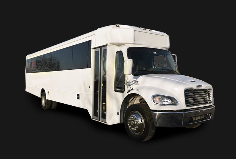 White 32 passenger party bus exterior, showcasing its larger size for bigger events