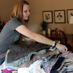 Clothes neatly folded on bed