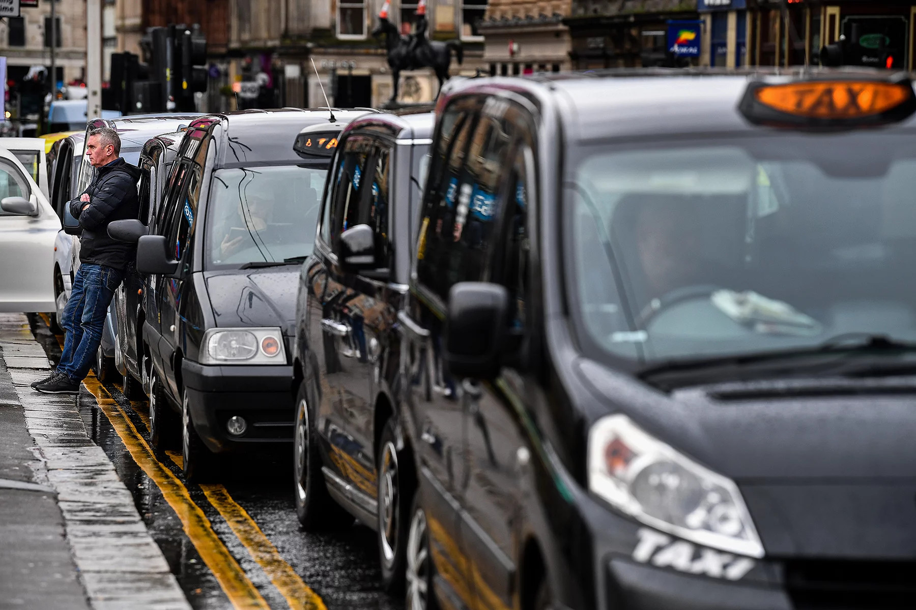 A row of taxis in Glasgow, UK