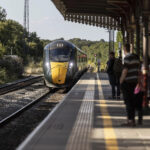 Train approaching a station platform in the UK